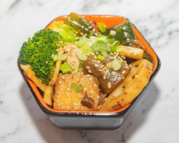 Mala xiang guo — Fire Wok's signature Szechuan spicy dry hot pot with peppercorns, broccoli, tofu, and sesame